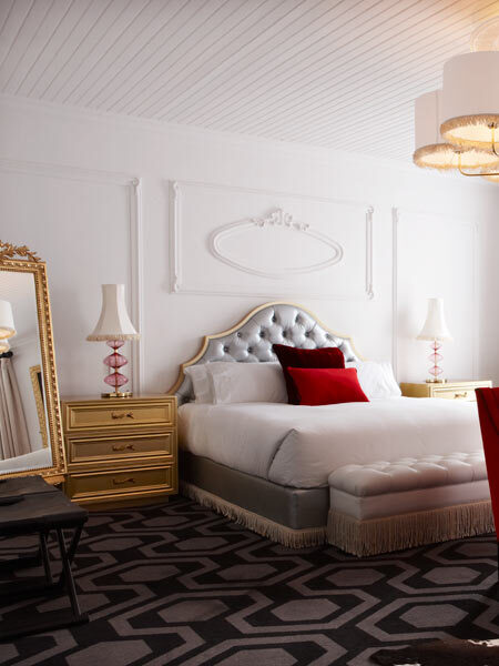 Alphen Hotel with ornamental plaster wall panelling and moulded cameo detailing above the headboards, shown in the Classic and Superior rooms