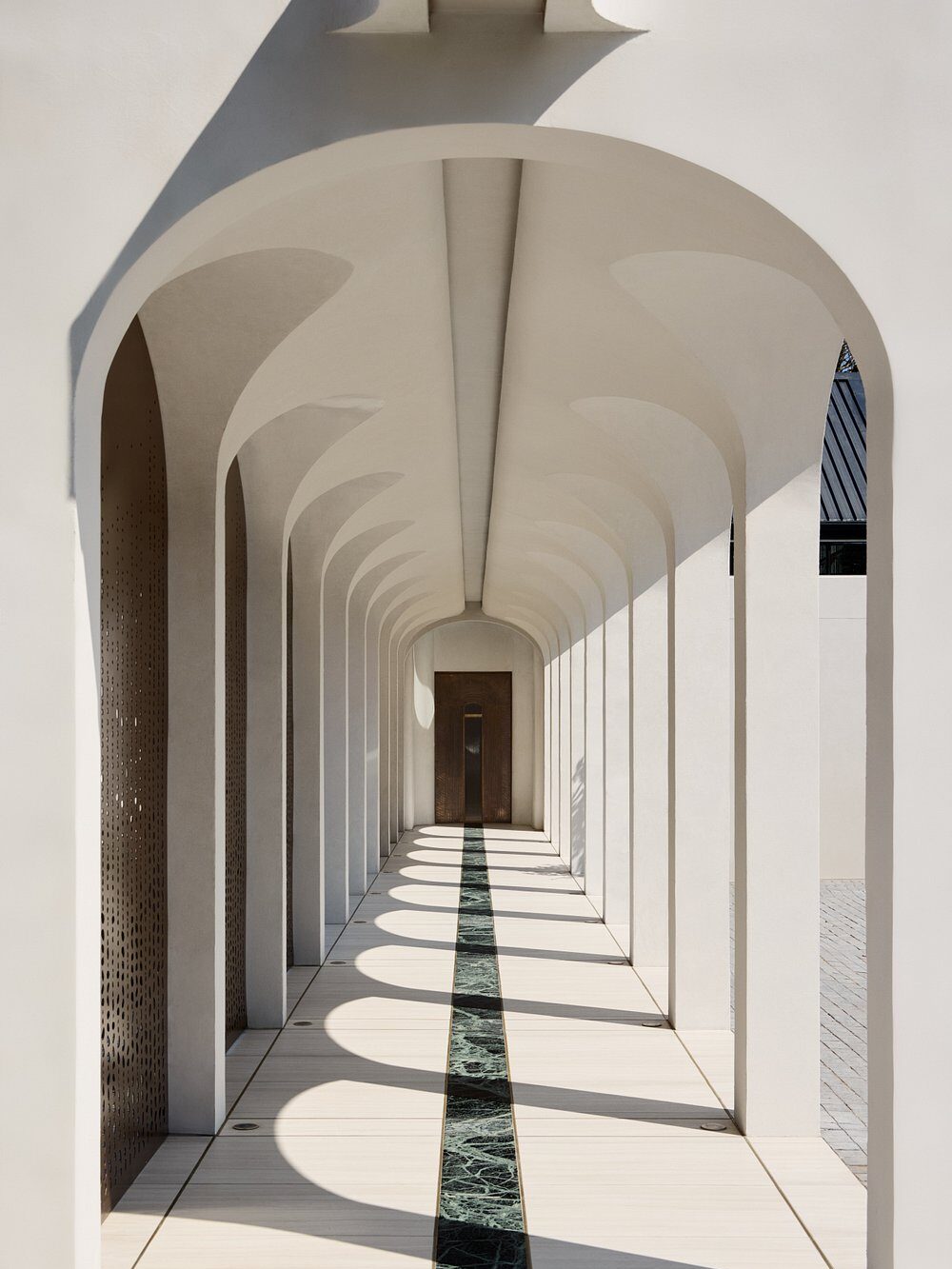 Terre Paisible Spa with hand-plastered vaulted archways, textured folded wall panelling and colonnades by Plaster Art SA, throughout its entrance and interior spaces