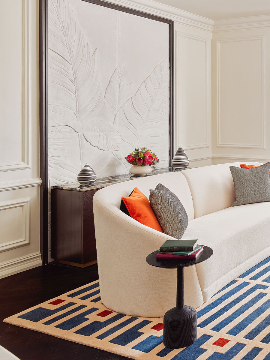 Cape Grace Hotel with hand-sculpted plaster detailing by Plaster Art SA — leaf relief panel, wall panel mouldings, and coffered ceiling — across its suites, library and restaurant